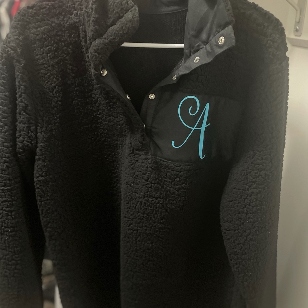 Black “A” monogram Sherpa pullover